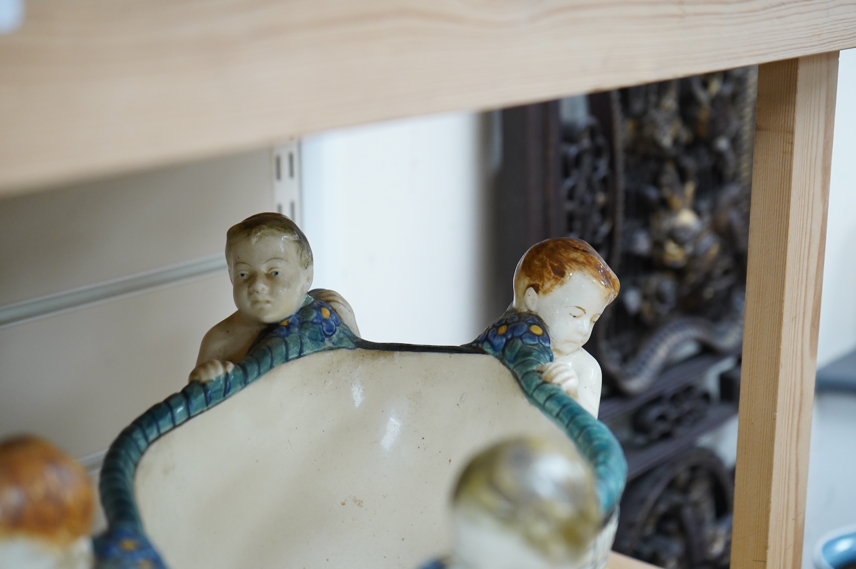 A Karlsruhe jardiniere with four putti designed by Wilhelm Süs in 1908, model number 1002, 33cm wide